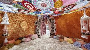 Embroidered textile artwork with detailed needlework